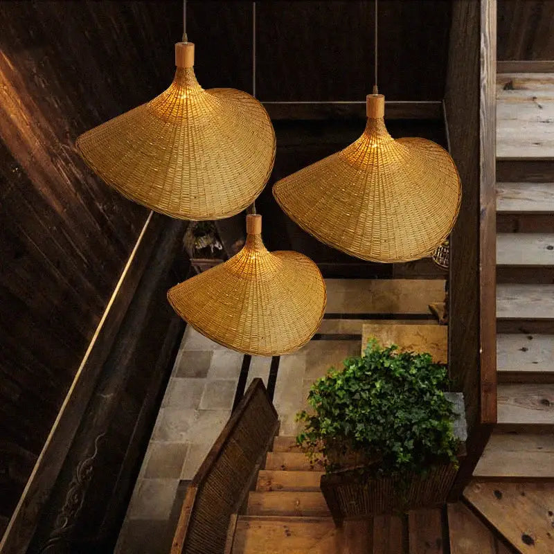 Three golden brown woven bamboo chandeliers led pendant lights with traditional conical design for dining room decorbites