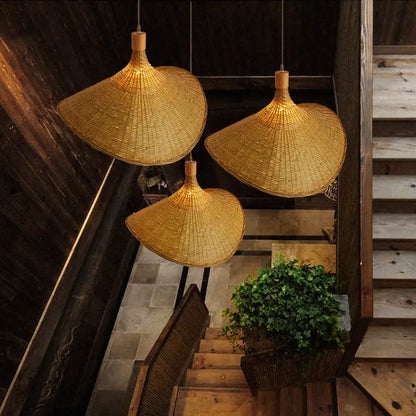 Three golden brown woven bamboo chandeliers led pendant lights with traditional conical design for dining room decorbites