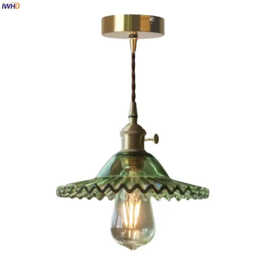 Vintage green brass glass led pendant light with brass fixture and twisted cord featuring ornate scalloped shade