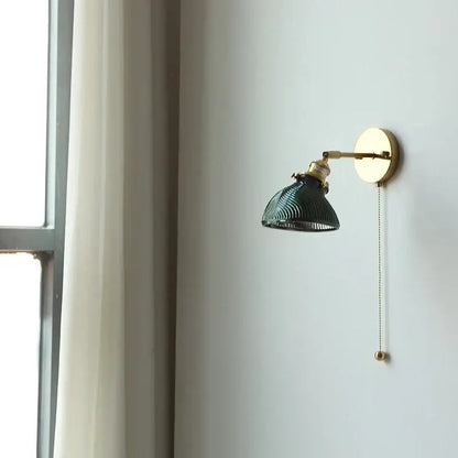 Vintage green glass led wall sconce with ribbed shade and brass finish ideal for bedroom or stair lighting