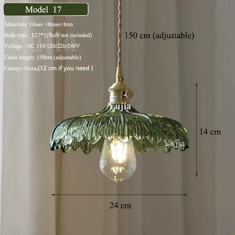 Vintage green glass pendant light with ruffled petal design and brass hardware for dining room illumination