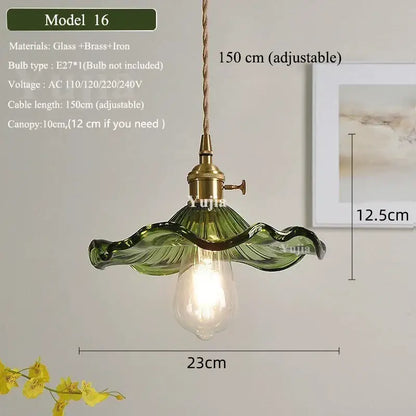 Vintage green glass pendant light with ruffled petal design, brass fixture, and adjustable cord for dining room use