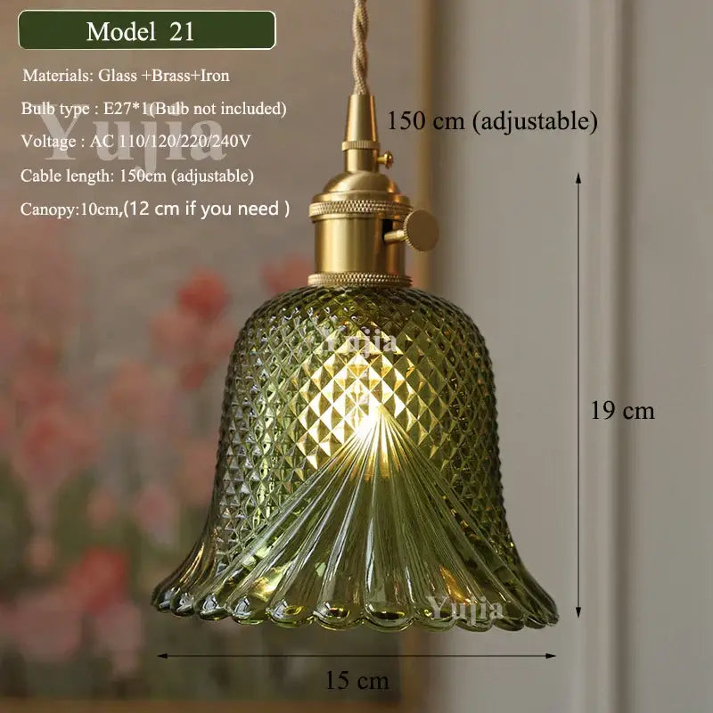 Vintage green glass pendant light with ruffled petal design and brass iron fixture featuring diamond-cut pattern