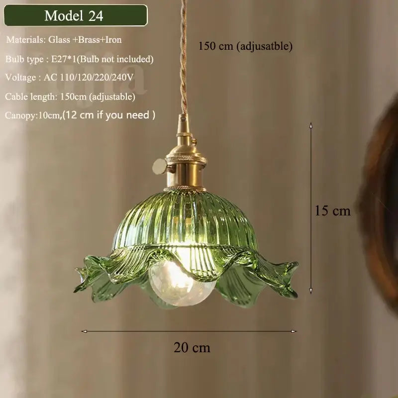 Vintage green glass pendant light with ribbed ruffled petal design and brass iron hardware for dining room use