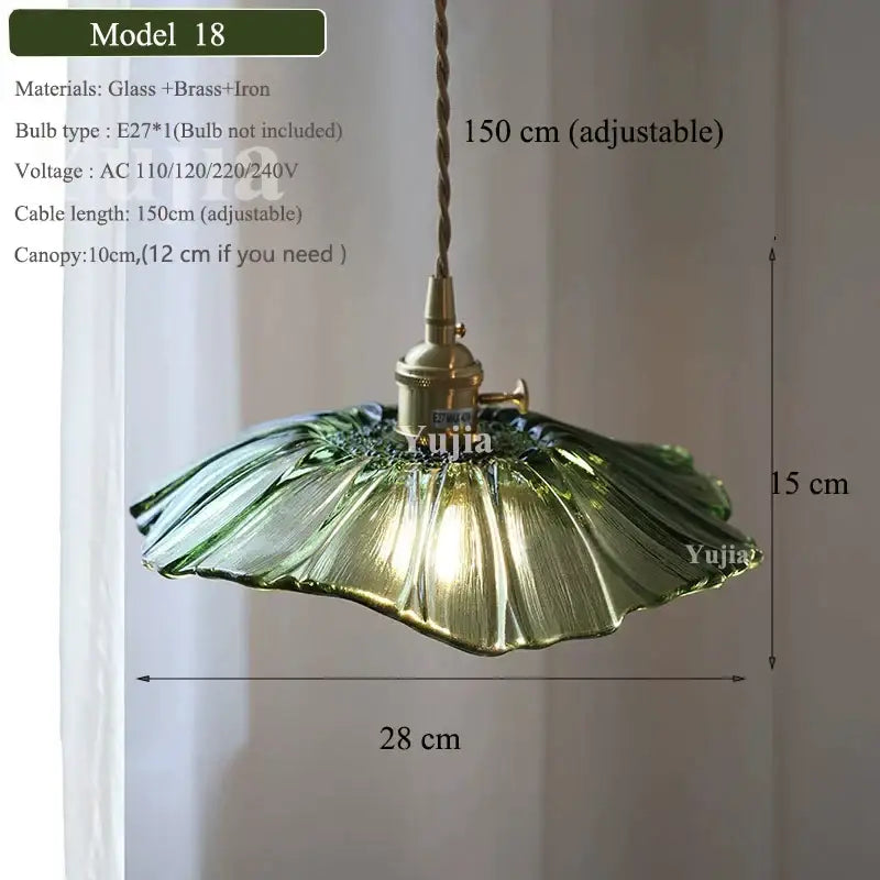 Vintage green glass pendant light with ruffled petal design brass fixture and adjustable cord for dining room use