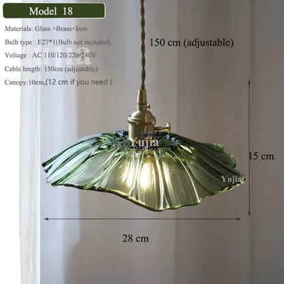 Vintage green glass pendant light with ruffled petal design brass fixture and adjustable cord for dining room use