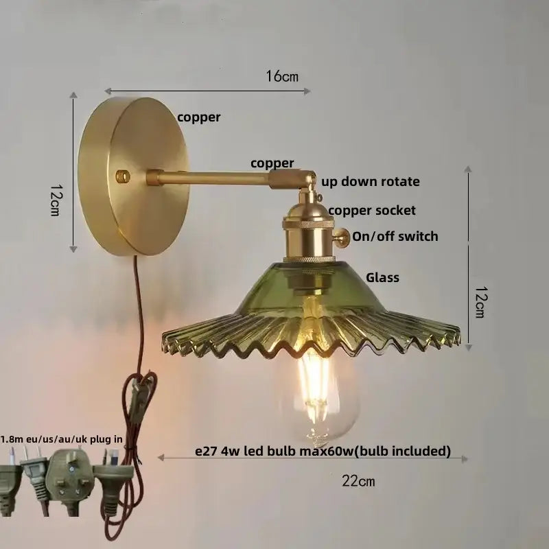 Vintage green glass wall light featuring a copper sconce with pull chain switch and exposed Edison bulb for bedroom use
