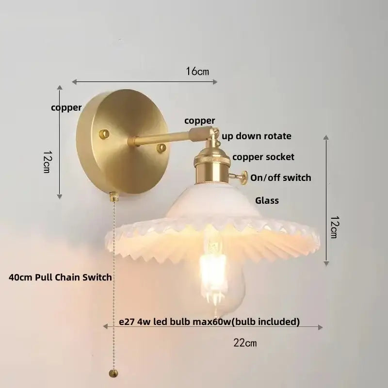 Vintage green glass wall light with brass sconce and pull chain switch featuring frosted glass shade and exposed bulb