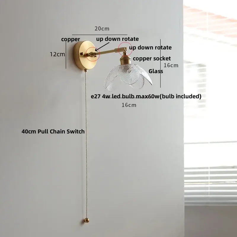 A brass-finished copper wall lamp with clear petal-shaped glass shade and adjustable arm for vintage green loft led use