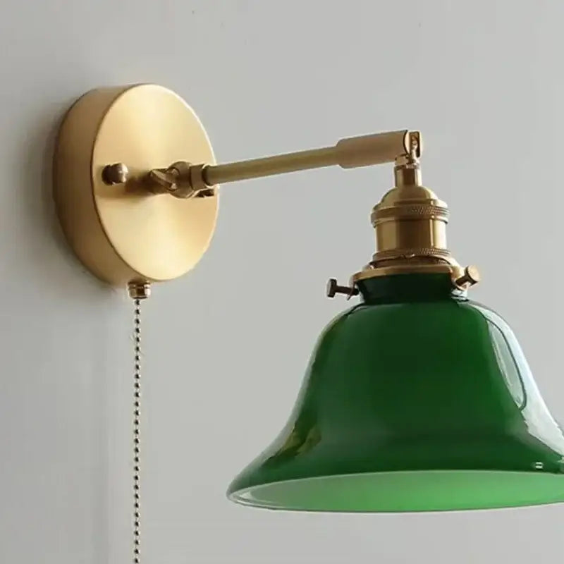 Vintage-style brass wall lamp with a glossy emerald green glass shade featuring a pull chain for loft led wall use