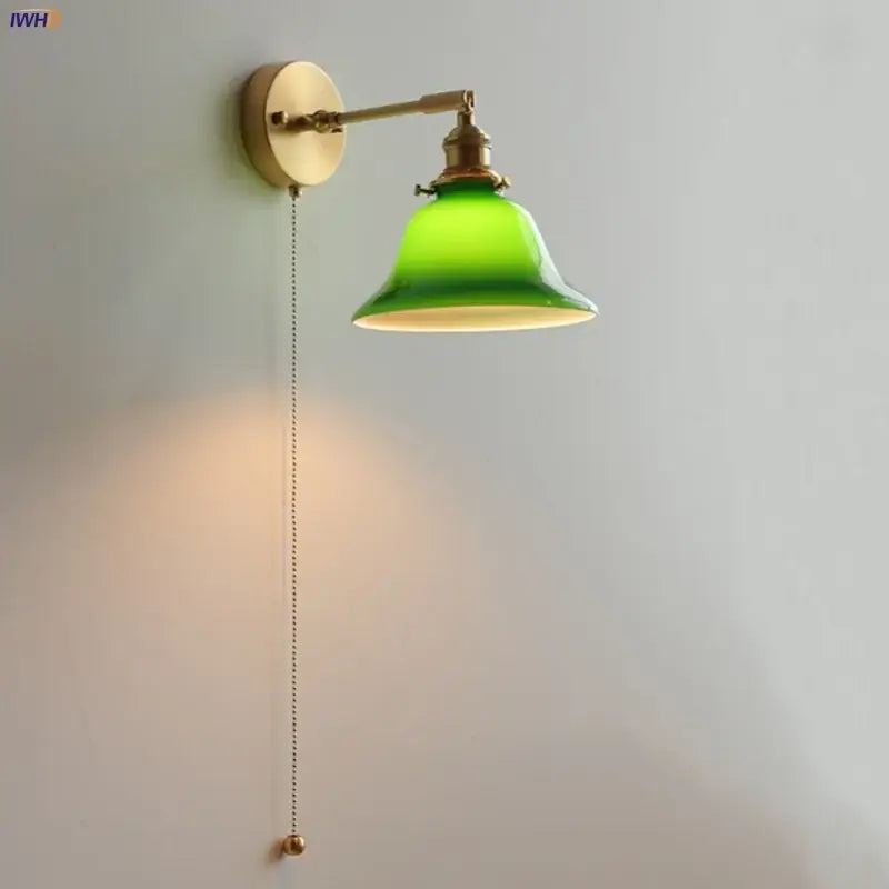Vintage green loft led wall lamp featuring a brass finish and vibrant glass shade with pull chain for bedroom use