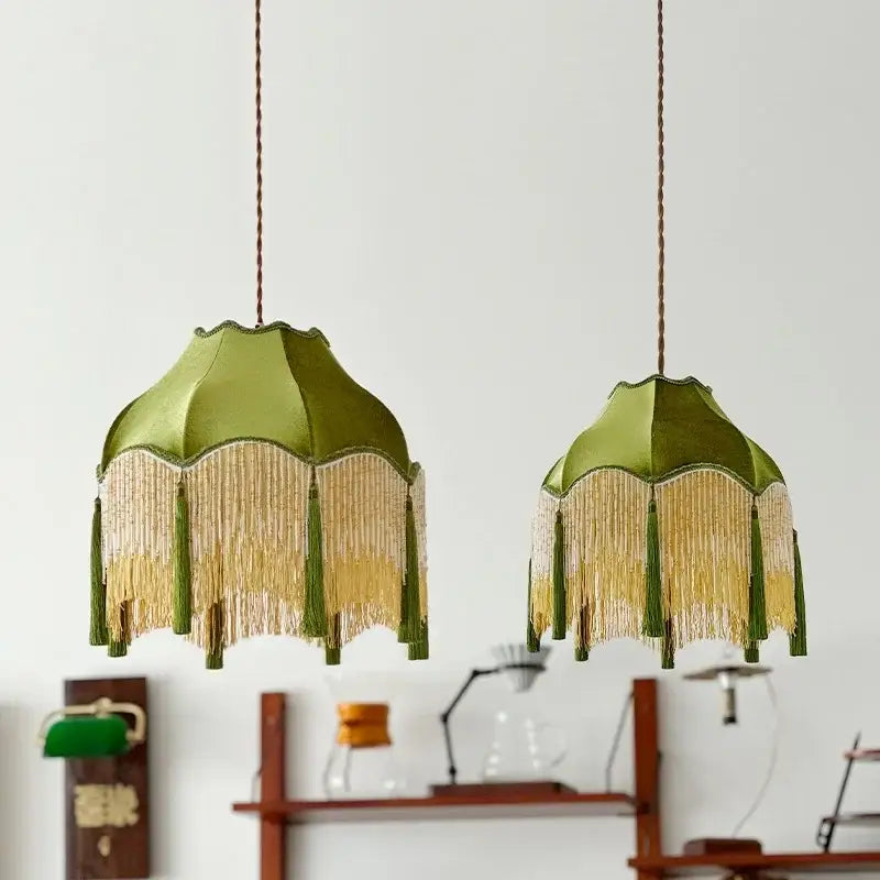 Two olive green silk lampshades with gold and matching tassels hanging from braided cords vintage green tassel pendant light decorbites green tassel