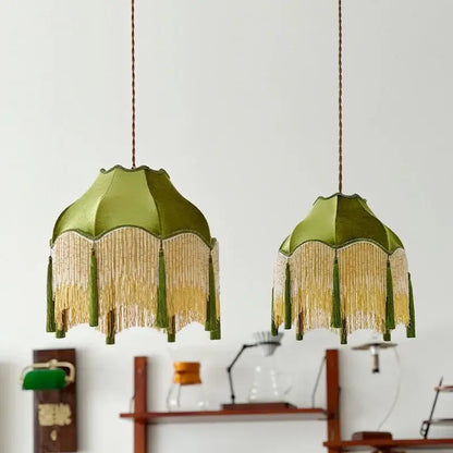 Two olive green silk lampshades with gold and matching tassels hanging from braided cords vintage green tassel pendant light decorbites green tassel