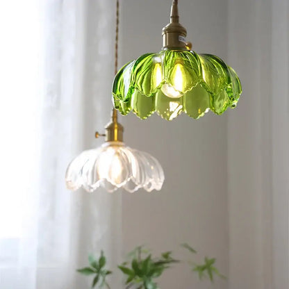 Vintage green and white glass flower pendant light with brass hardware, thoughtfully styled for dining room use