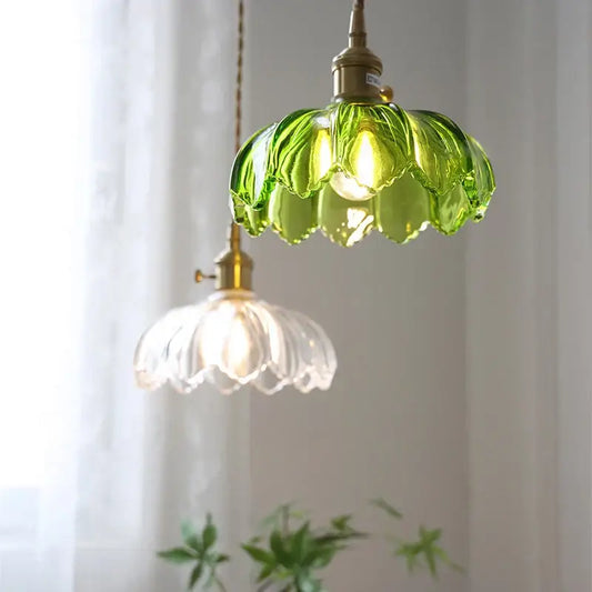 Vintage green and white glass flower pendant light with brass hardware, thoughtfully styled for dining room use