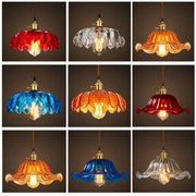 Vibrant vintage hand blown glass pendant lights with red blue amber and clear petal shades and brass fixtures for living room