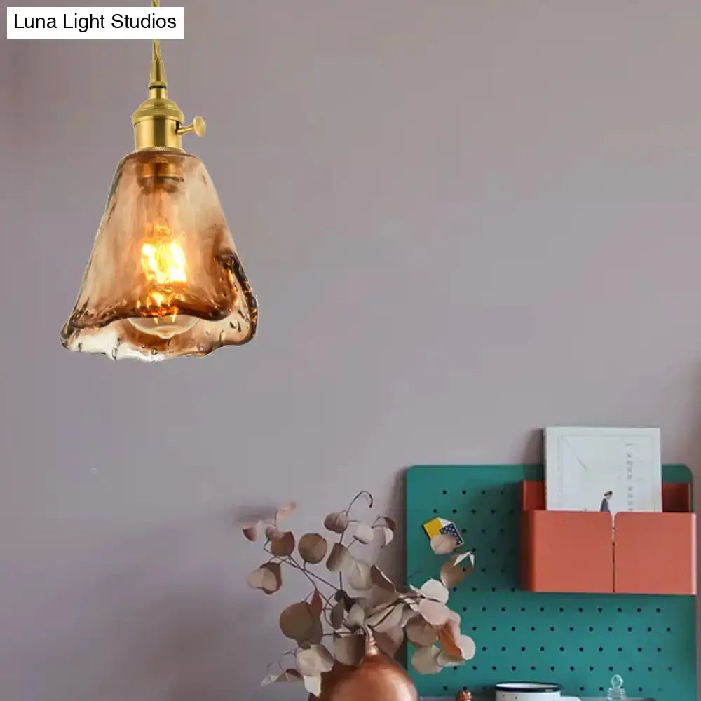 Aubrey vintage handmade brass shaded tan glass pendant light with a warm amber drop and brass fixture