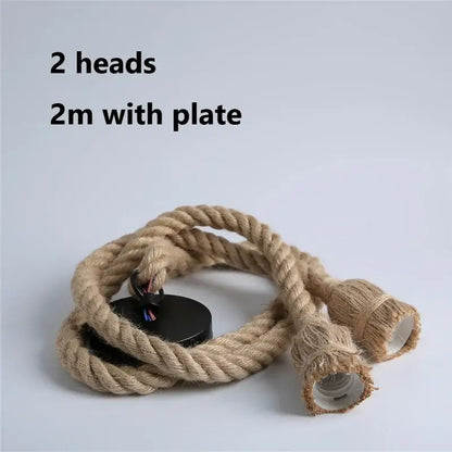 Vintage hemp rope pendant light with two exposed bulbs and black mounting plate for focused dining room lighting