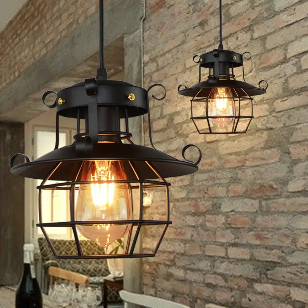 Vintage industrial black metal pendant light with cage enclosure and exposed filament bulb cord pendant for kitchen use