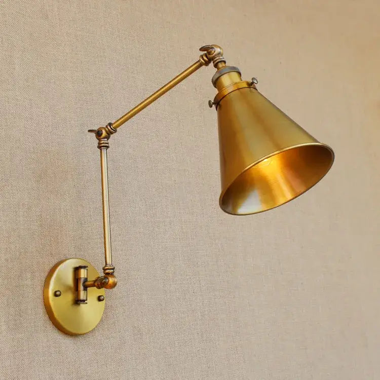 Brass-finished vintage industrial wall lamp with adjustable swing arm and conical shade for bedroom reading decorbites adjustable swing