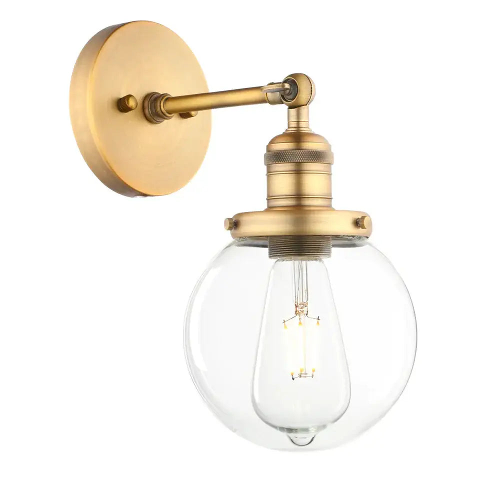 Brass-finished vintage industrial wall sconce with clear glass globe shade and exposed filament bulb for bedroom decorbites vintage industrial use