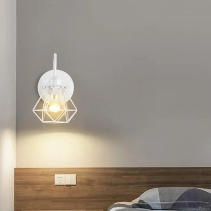 White geometric decorbites industrial cage wall lamp with warm glowing bulb for vintage bedroom sconce lighting