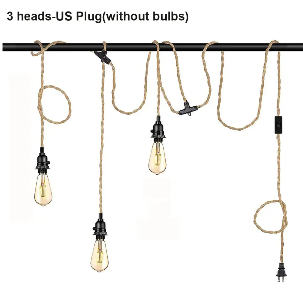 Vintage industrial pendant light with black metal fixtures and beige hemp rope cords featuring edison bulbs for dining room