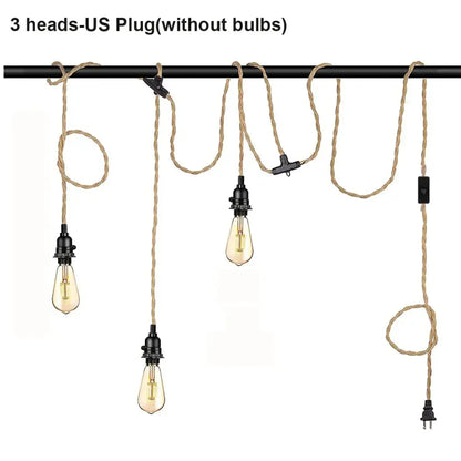 Vintage industrial pendant light with black metal fixtures and beige hemp rope cords featuring edison bulbs for dining room