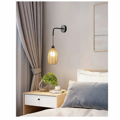 A warm-toned woven rattan wall lamp with black metal arm featuring decorbites industrial hemp rope sconce design
