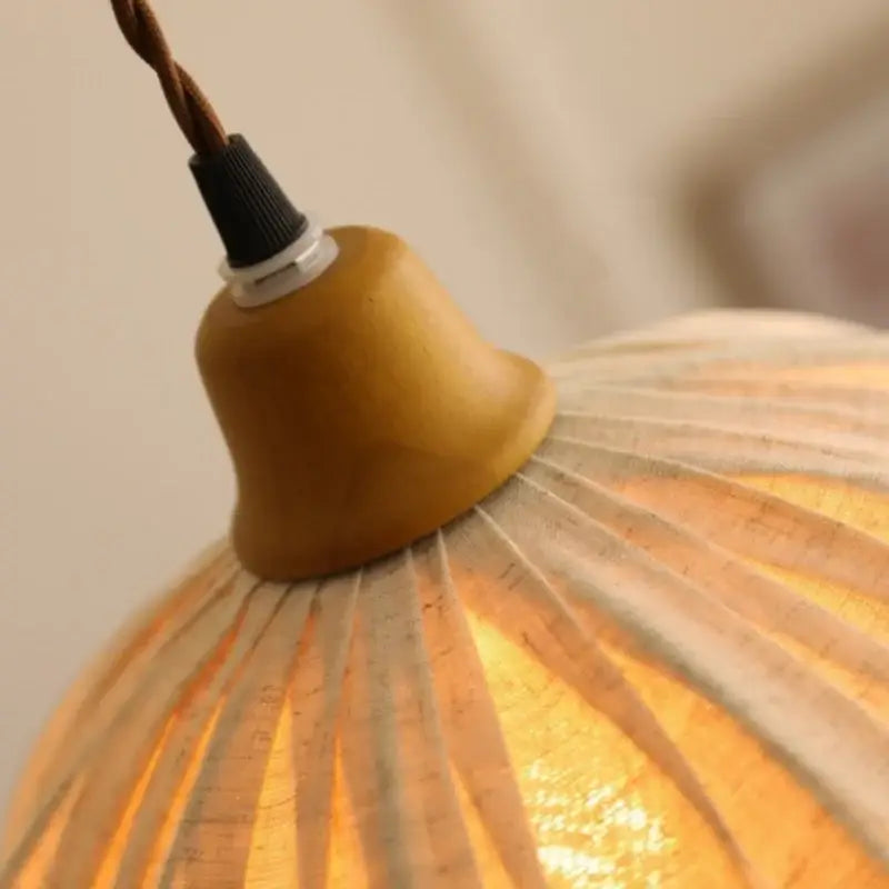 Vintage Japanese pendant light featuring warm-toned wood bell shape and decorbites beige cloth led cork shade with twisted cord