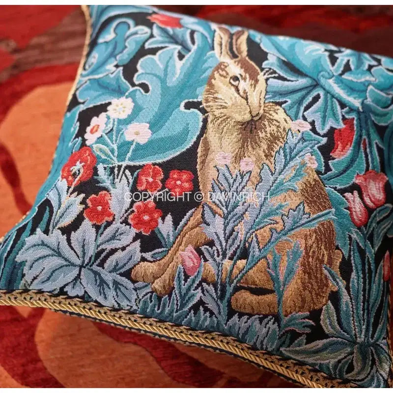 Square cushion cover with vintage lion tapestry jacquard featuring brown hare red poppies and gold braided trim decorbites lion tapestry