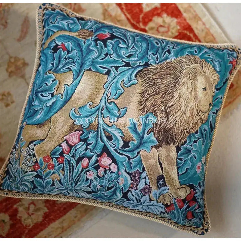 Square cushion cover featuring a decorbites lion tapestry jacquard with vibrant blue foliage and a beige rope border decor