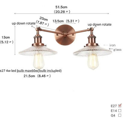 Copper-toned vintage loft wall lamp with two adjustable industrial vintage arms and clear ribbed glass shades for bedroom decorbites