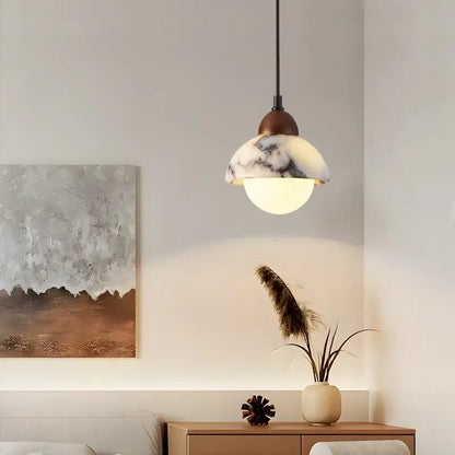 Vintage marbled glass ball led pendant light with warm glowing glass shade and dark bronze fixture for bedroom decorbites