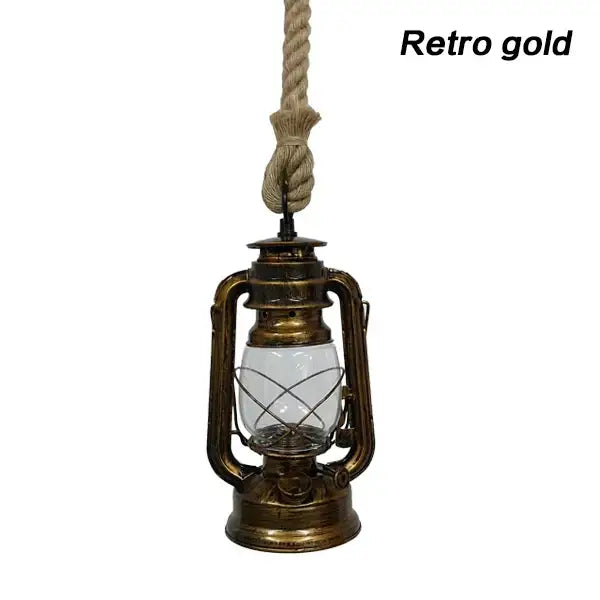 Retro gold pendant light with glass globe and metal construction suspended by thick rope for decorative presence