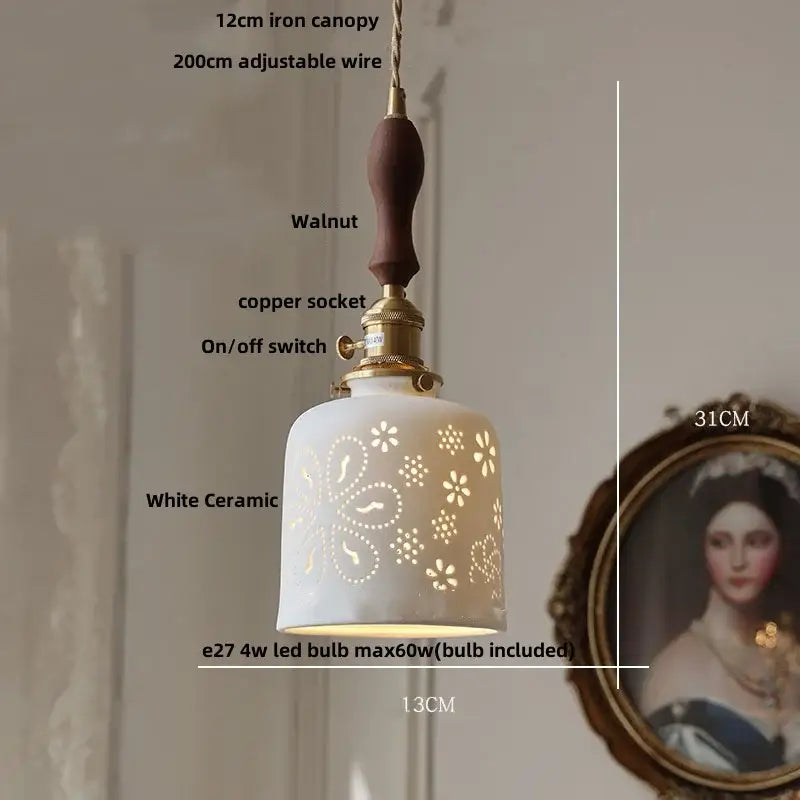 Vintage pale blue enamel pendant light with white ceramic knob switch featuring floral cutouts and walnut handle decorbites ceramic knob