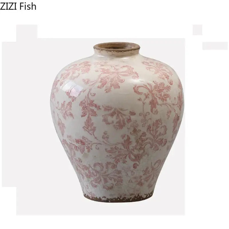 Vintage pink floral porcelain vase with cracked texture and chipped rim for living room decor by decorbites