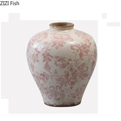 Vintage pink floral porcelain vase with cracked texture and chipped rim for living room decor by decorbites