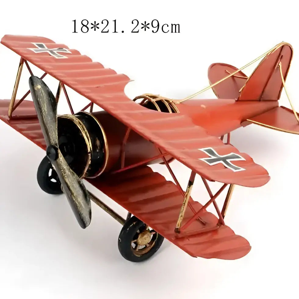 Vintage red iron airplane figurine with black and gold accents and landing gear for bedroom decorbites iron airplane decor