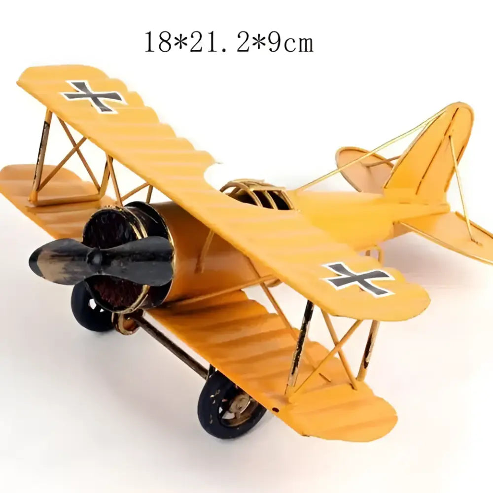 Yellow metal iron airplane figurine with black cross insignia and propeller vintage decorbites bedroom decor