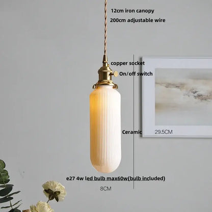 A warm cream-colored vintage ribbed ceramic wood led pendant light with vertical ridges and brass copper socket for dining room decorbites ceramic wood