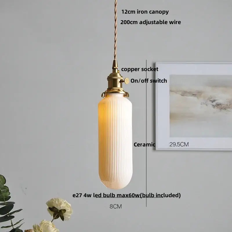A warm cream-colored vintage ribbed ceramic wood led pendant light with vertical ridges and brass copper socket for dining room decorbites ceramic wood