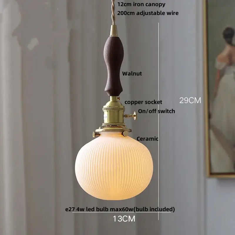 A warm ribbed ceramic wood led pendant light with walnut iron canopy and brass socket for dining room decorbites ceramic wood