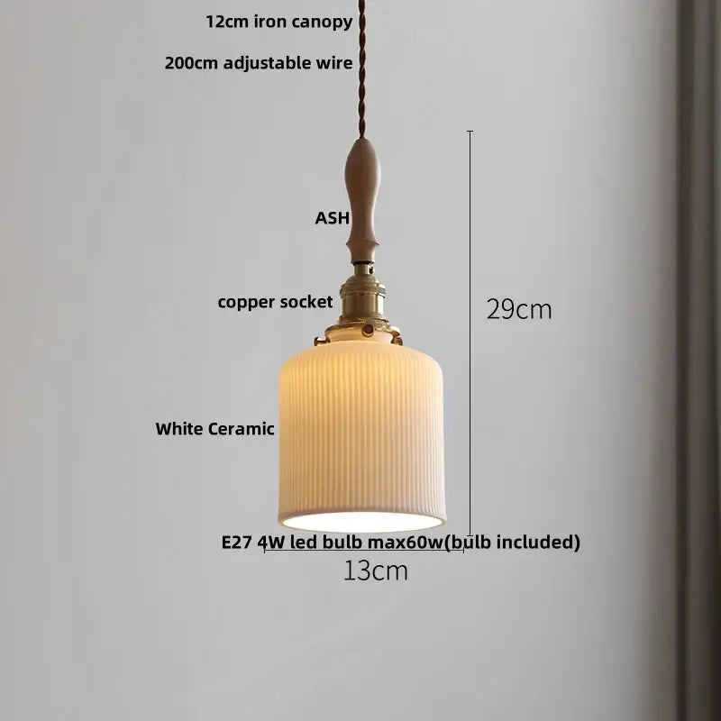 A warm-toned white ceramic led pendant light with vertical ridges, brass copper socket, and ash wood canopy decorbites ceramic led