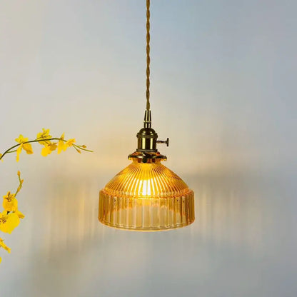 A warm amber glass pendant light with ribbed vintage-inspired design and brass hardware for decorbites glass hanging lamp
