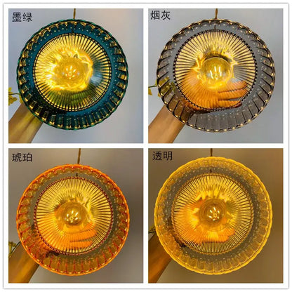 Vintage ribbed green glass hanging lamp pendant light featuring a circular fluted design with amber glow bulb