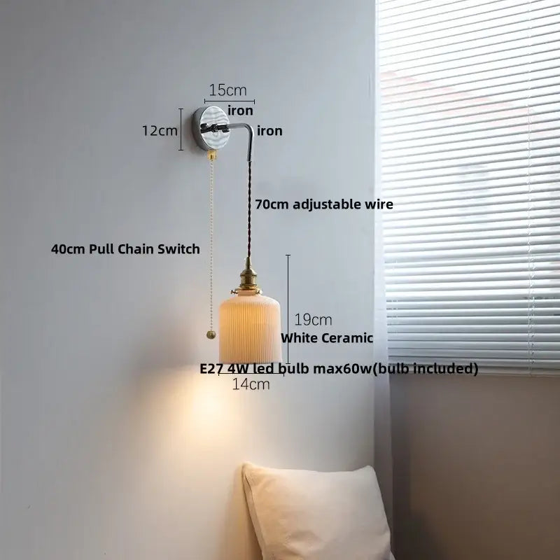 White ceramic wall lamp with brass-finished fixture and adjustable wire featuring decorbites ceramic canopy led design