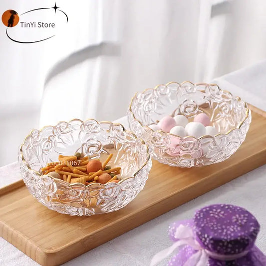 Vintage rose etched glass salad bowl with gold rim filled with snacks in clear glass bowls for dining room use