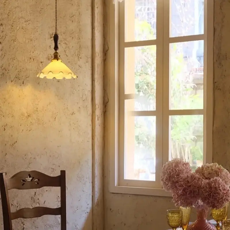 Vintage scalloped cream glass led pendant light with warm yellowish shade and ornate brass fixture for kitchen decorbites