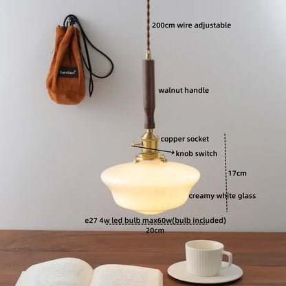 A warm creamy white glass pendant light with walnut handle and brass copper socket for dining room decorbites copper walnut